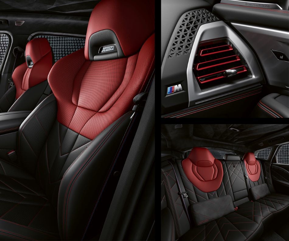 Detail of front seats, clad in exclusive BMW Individual Fiona Red & Black Merino Leather with exclusive M Signature Trim and red stitching and accents. Detail of red accented vent. Detail of rear M Lounge with exclusive XM pillows in Tom Bush BMW Jacksonville | Jacksonville FL