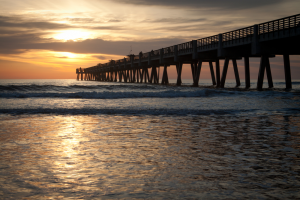 Sunset and pier on the beach
