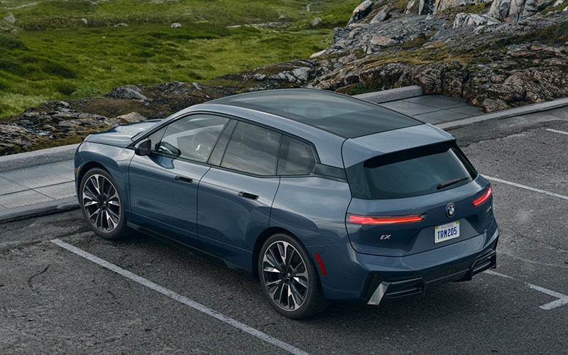 The BMW iX parked in a parking spot. | Tom Bush BMW Jacksonville in Jacksonville FL