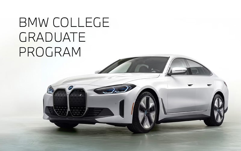 White BMW i4 parked. BMW College Graduate Program. | Tom Bush BMW Jacksonville in Jacksonville FL