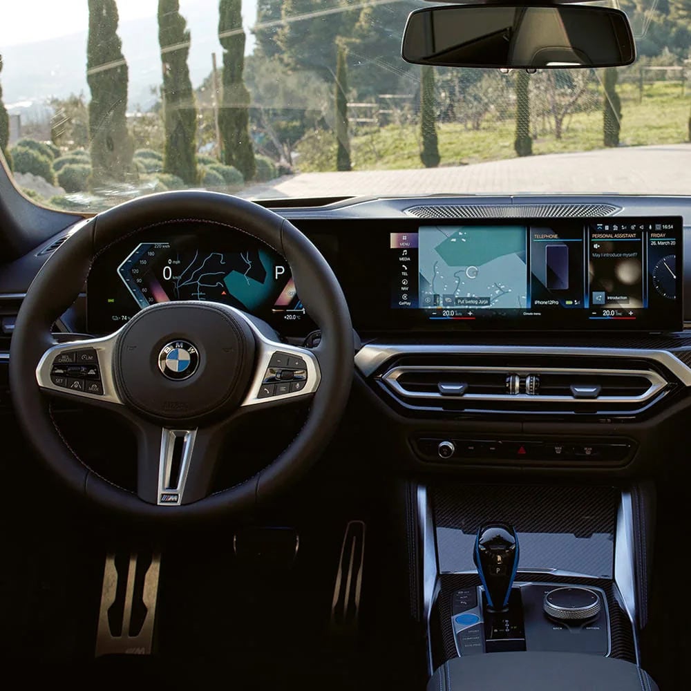 A driver's eye view of steering wheel and controls of the BMW i4 | Tom Bush BMW Jacksonville in Jacksonville FL